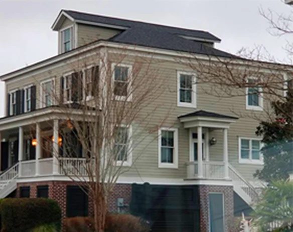 Large two-story home with porches and a new roof