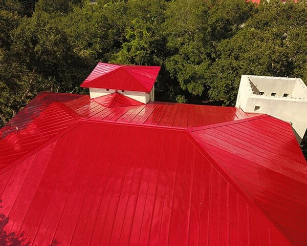 Close aerial view of a finished red metal roof