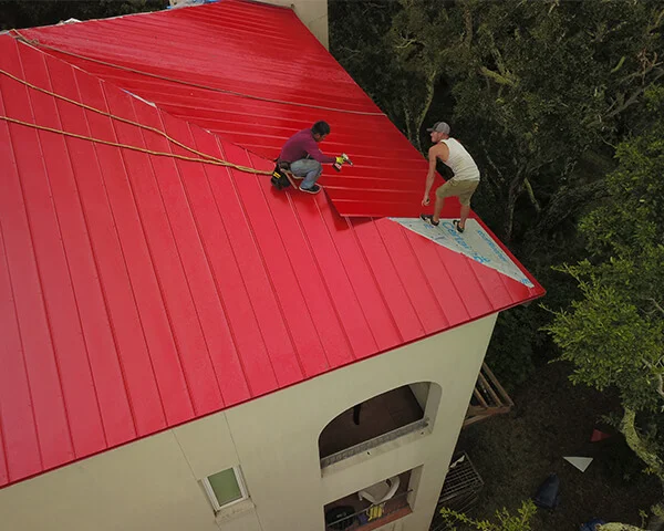 Aerial view of a metal roof replacement in progress