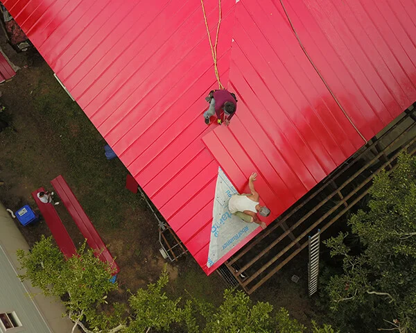 Aerial view of a metal roof partly replaced