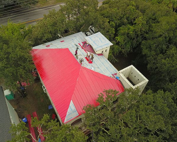 Aerial view of metal roof panels going on a home