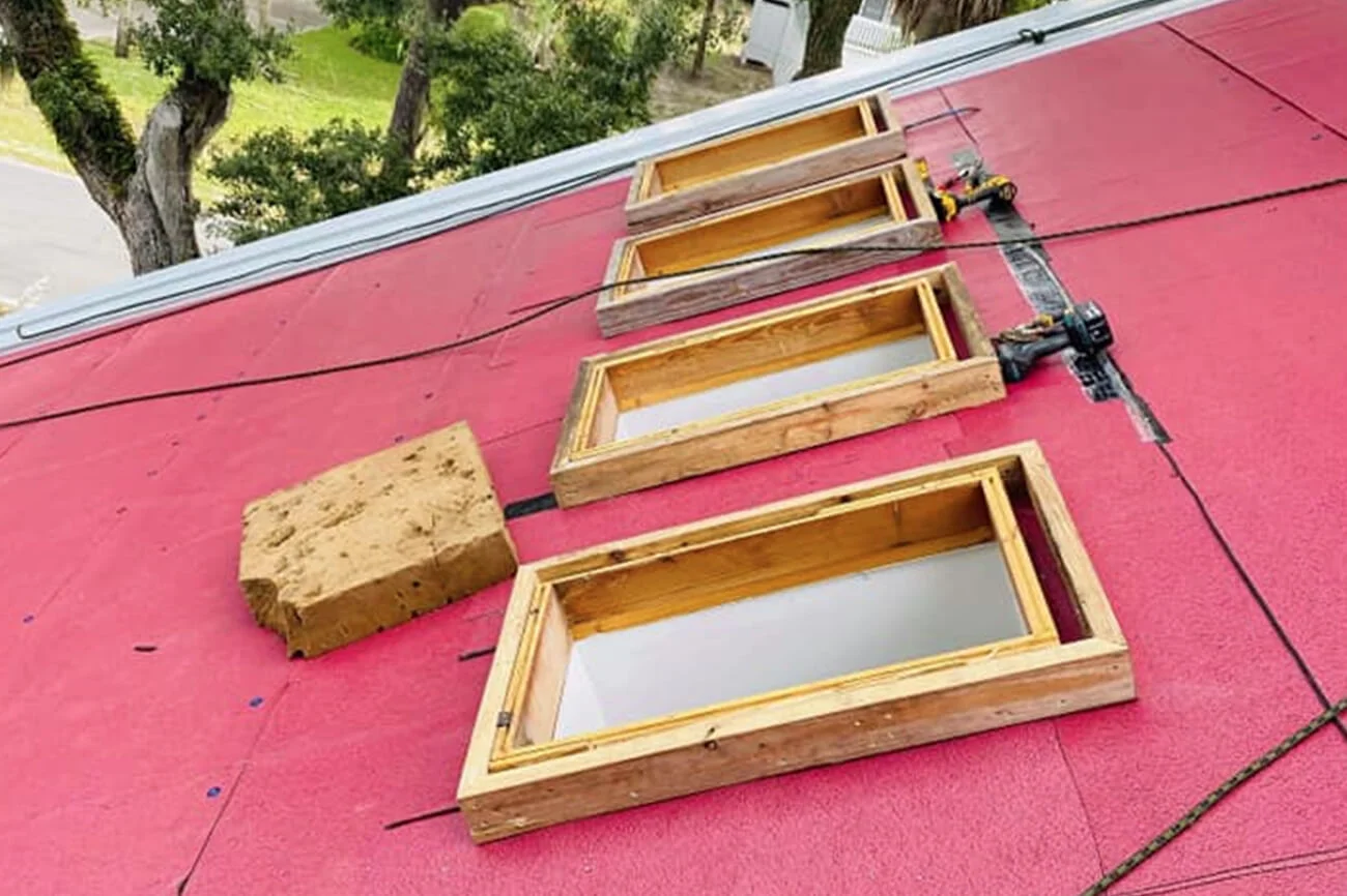 Wood curbs framed for skylights on new roof underlayment